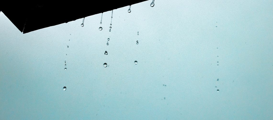A closeup of water drops from the ceiling